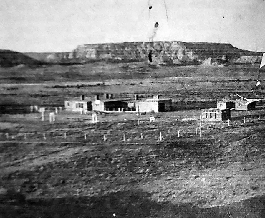 A black and white photo of the original Lake Valley Navajo School building.