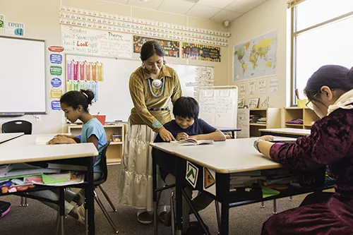 Students and teacher in a classroom.